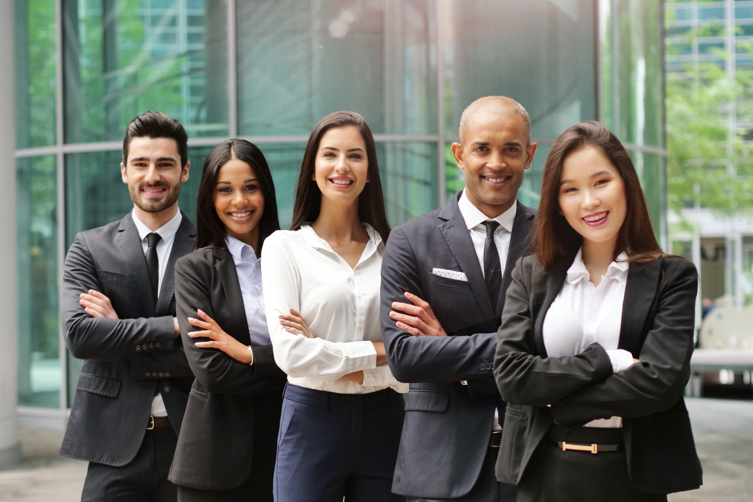 Portrait of business people of different ethnic backgrounds dressed in suits,